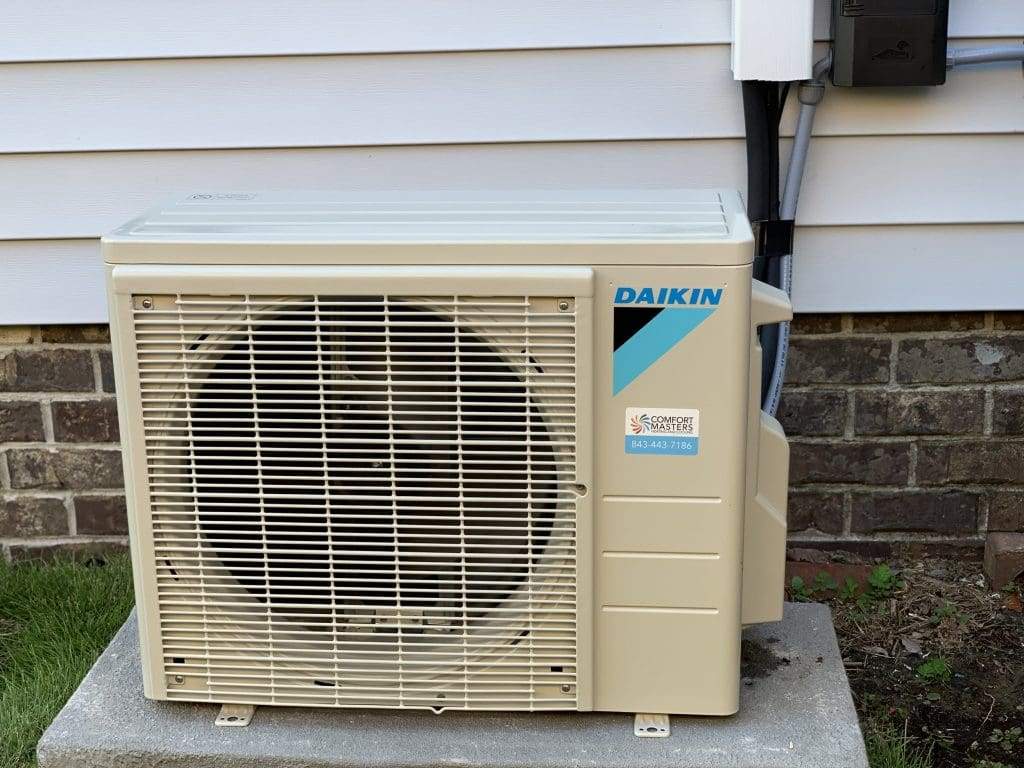 Daikin ductless mini-split outdoor unit on a concrete pad