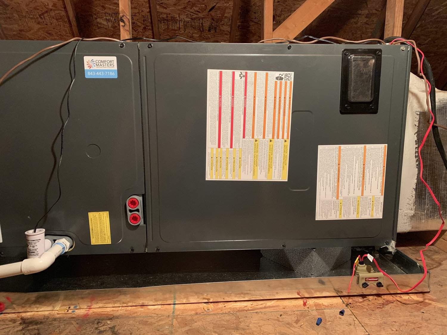 Horizontal air handler installed on a platform in an attic