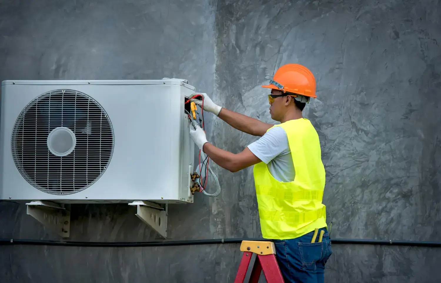 Comfort Masters technician checking an outdoor AC condenser during a North Myrtle Beach heat wave
