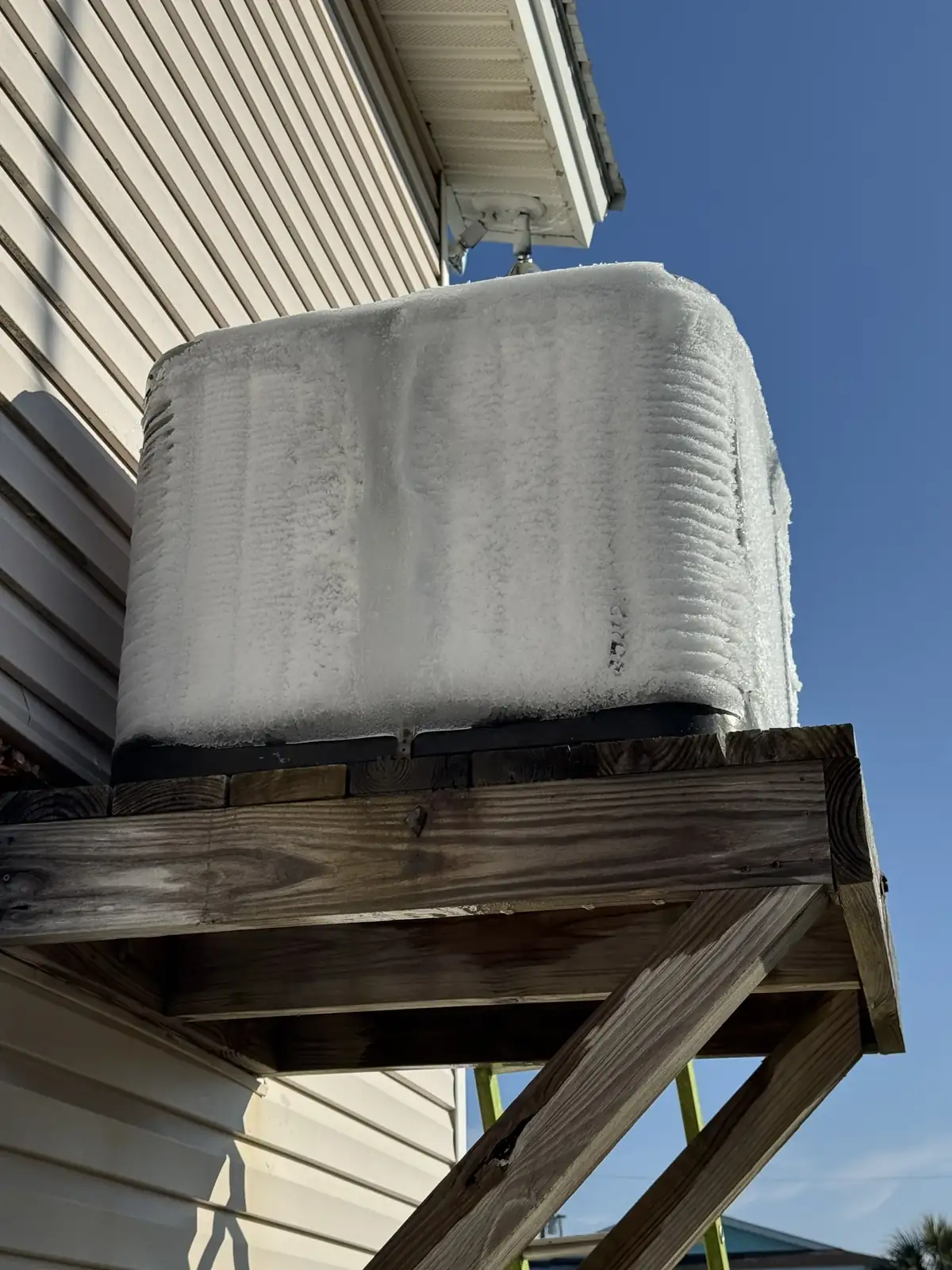 A coastal heat pump iced over after a failed defrost board, North Myrtle Beach area