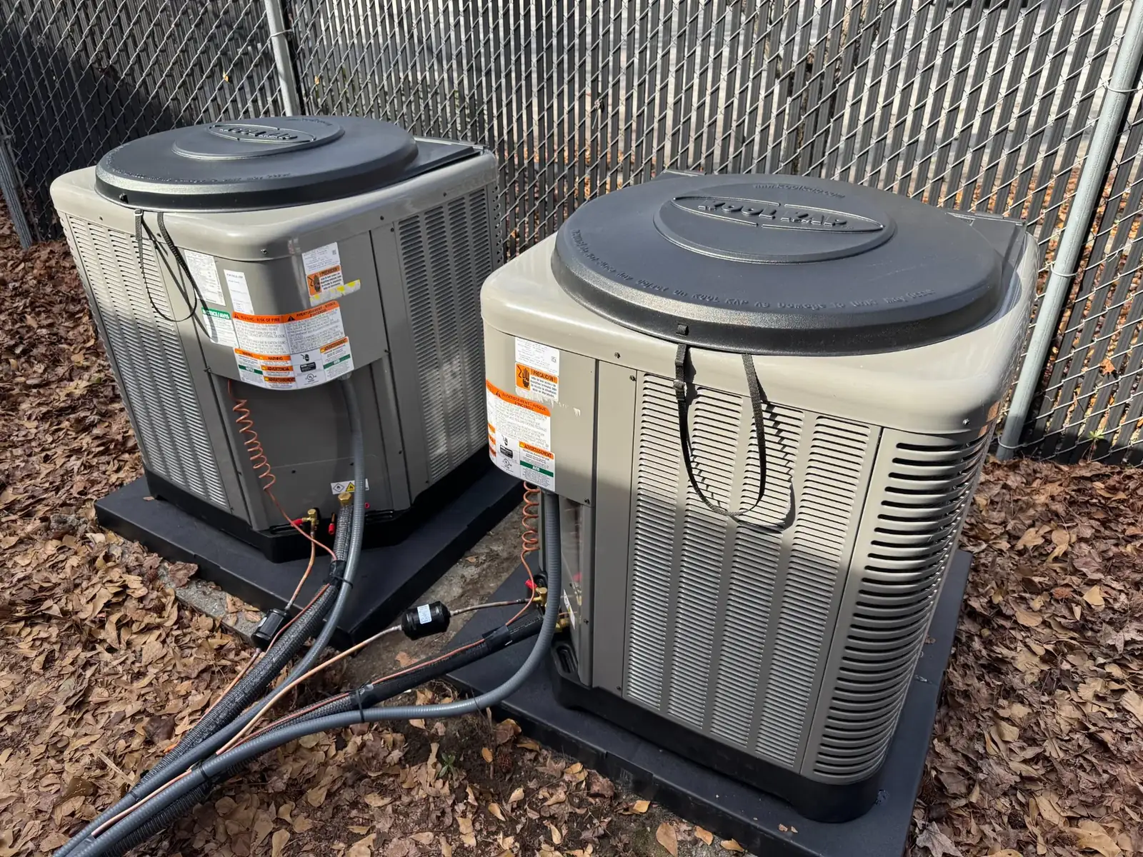 Outdoor condensers on a coastal home where a clogged filter caused the indoor coil to freeze