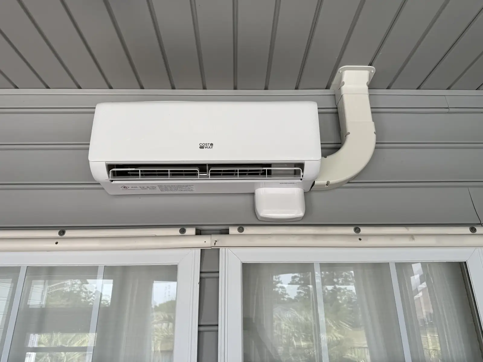 Ductless mini-split indoor unit mounted on a porch wall